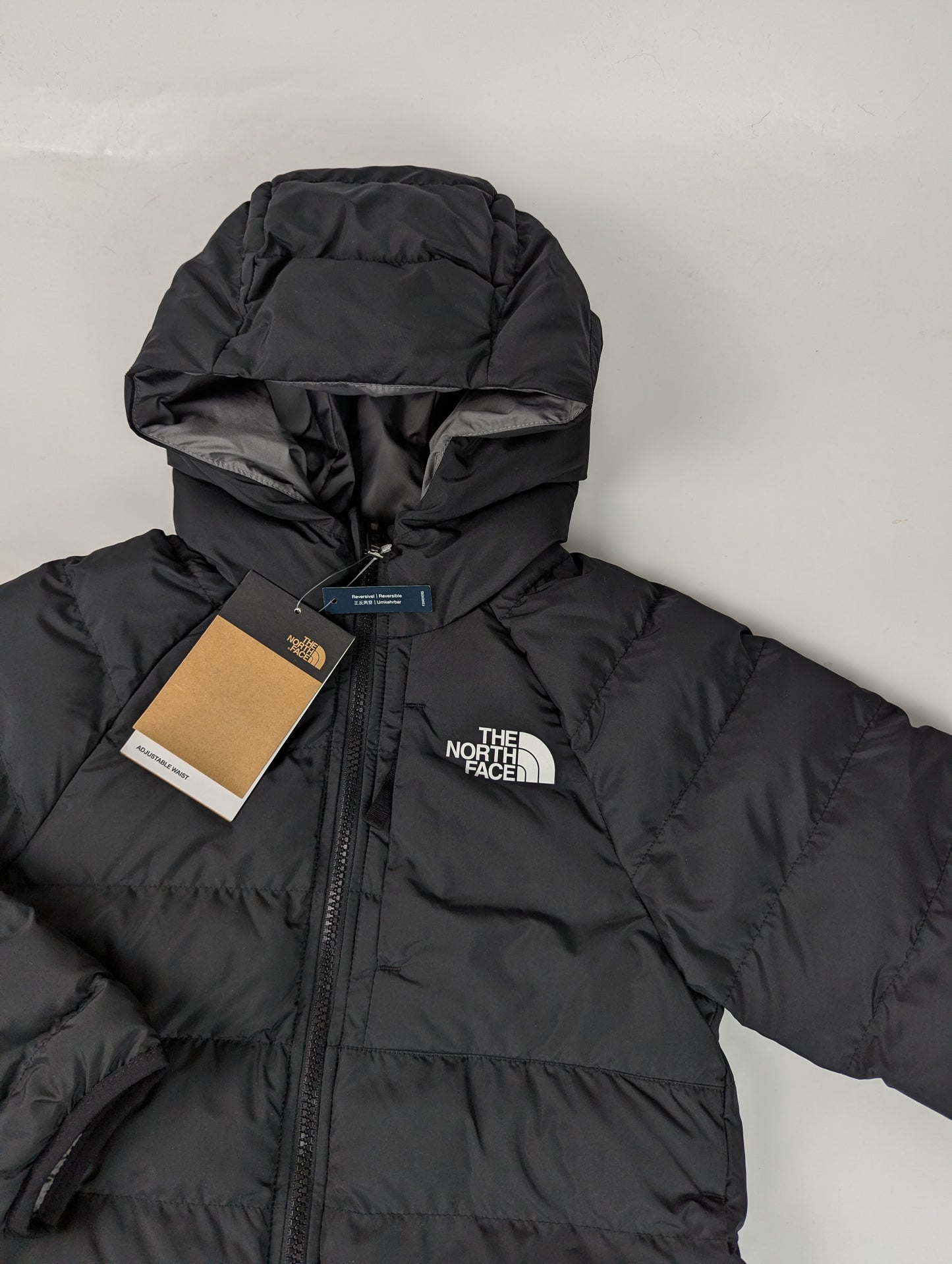 The North Face kids Reversible Perrito Short Puffer Jacket - Black / Grey